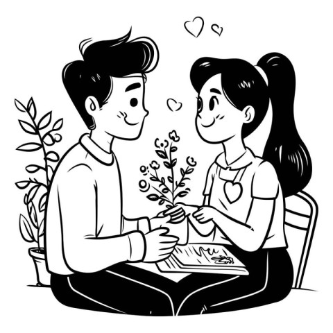 Couple in love sitting at the table and holding a plant in their