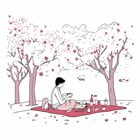 Romantic picnic in the park of a man sitting on the grass and re