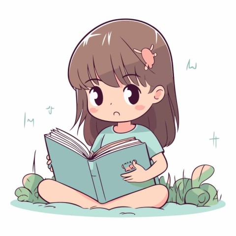 Cute little girl reading a book on the grass.