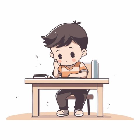 Cute little boy sitting at the desk and doing homework