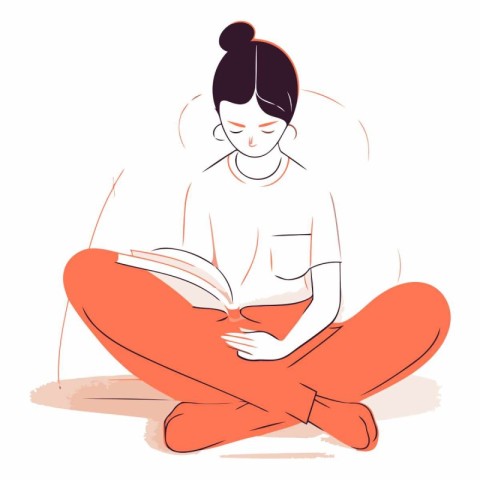 Young woman reading a book sitting on the floor.