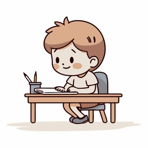 Boy sitting at the desk and writing in notebook.