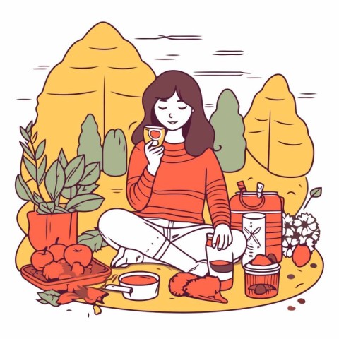 Girl sitting on the ground in the park and drinking tea