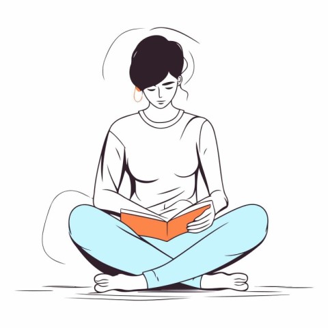 Young woman sitting on the floor reading a book.