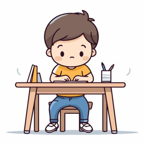 Cute little boy sitting at the table and writing.