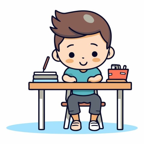 Cute boy sitting at the desk and studying.