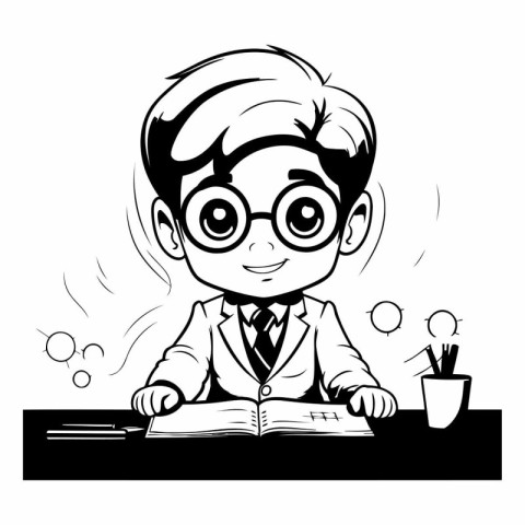 Boy in glasses reading a book at the desk.