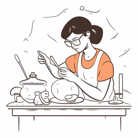 Woman cooking in the kitchen of a woman in glasses cooking in th