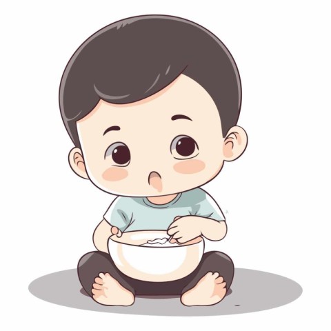 Cute little boy sitting and eating a bowl of milk.