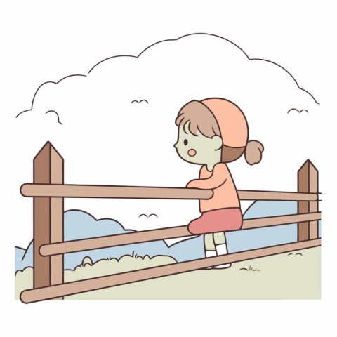 Little girl playing on a wooden fence in the countryside.