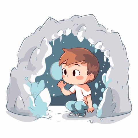 Cute little boy sitting in the ice cave.