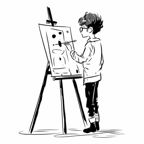 A boy draws a picture on an easel.