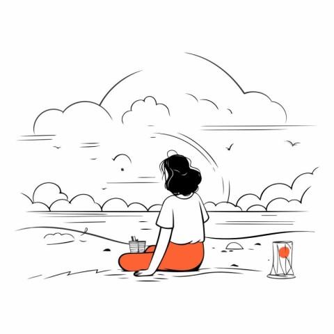 Girl sitting on the beach and looking at the sea