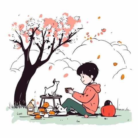 Boy playing with dog on a picnic in the park