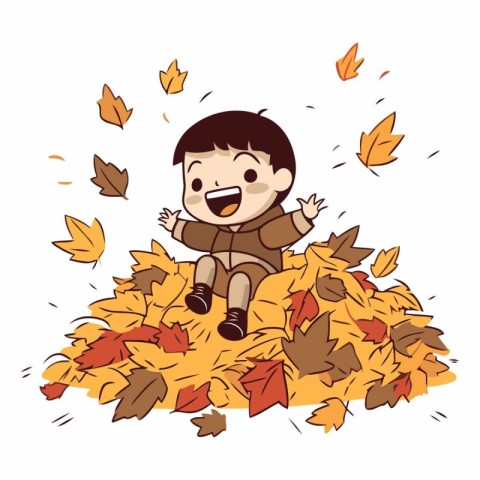 Happy boy sitting on a pile of autumn leaves.