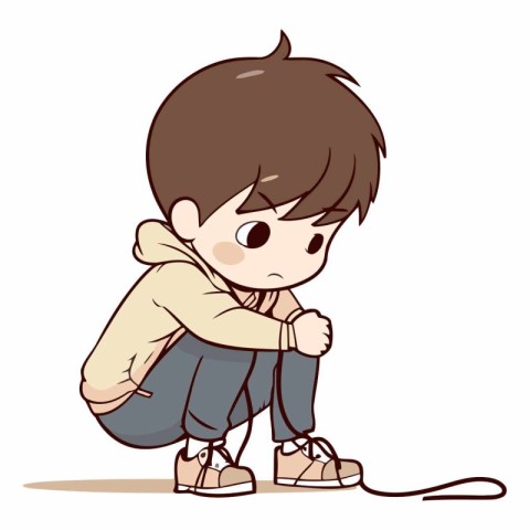 Sad boy sitting on the floor and holding his head.