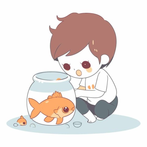 Cute little boy playing with goldfish in aquarium.