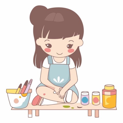 Cute little girl painting with watercolor paints.