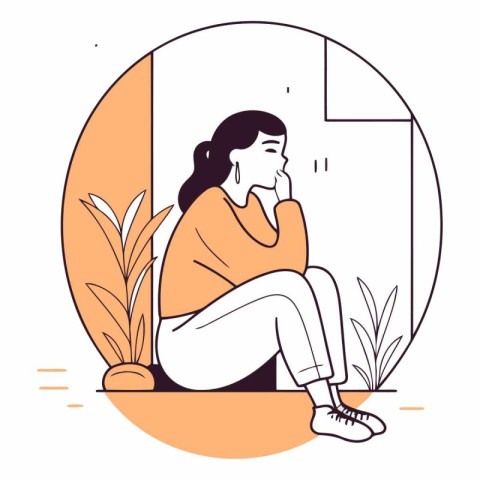 Sad woman sitting on the floor in front of the window