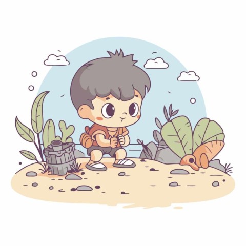 Cute little boy sitting on the sand and holding a treasure chest