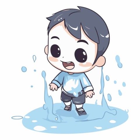 Cute little boy playing in a puddle of water.