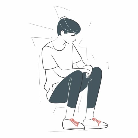 Sad young man sitting on the floor and thinking about something