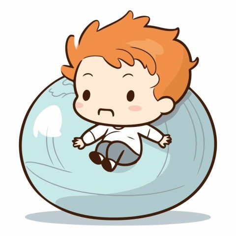 Cute little boy sitting on a big ball.