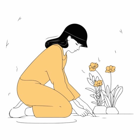 Girl in a hat sits on the floor and holds a flower in her hands