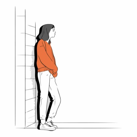 Young girl standing near the wall of a girl in casual clothes.