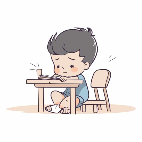 Boy sitting at the table and playing with a pencil.