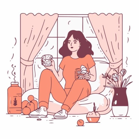 Girl in pajamas sitting on the bed and drinking tea or coffee