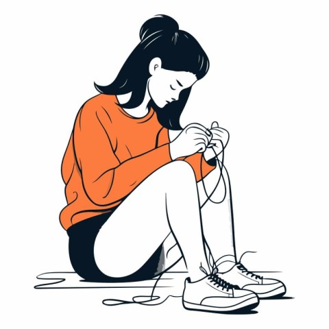 Girl sitting on the floor and knitting a sweater.