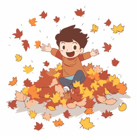 Happy little boy sitting on a pile of autumn leaves.