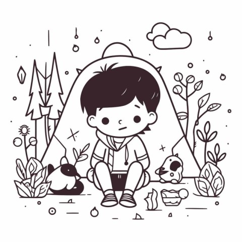 Cute little boy sitting on the ground in forest