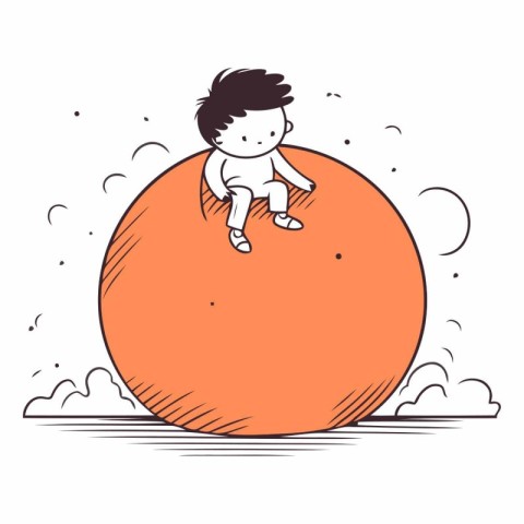 Cute little boy sitting on a big orange ball.