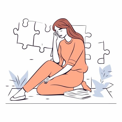 Sad woman sitting on the floor with puzzle pieces.