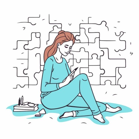 Girl with mobile phone sitting on the floor in front of a maze