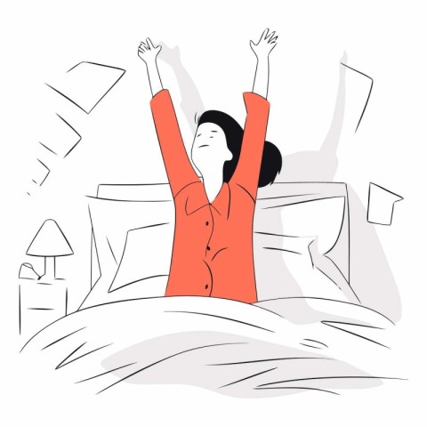 Happy young woman waking up in the morning in bed.