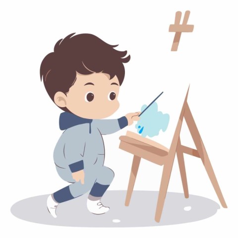 Cute little boy painting on the easel.