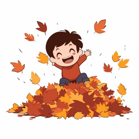 Happy boy sitting on a pile of autumn leaves.