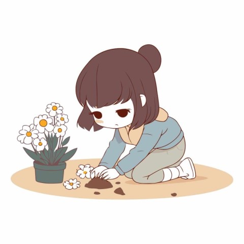 A cute little girl who is planting a flower in the garden.