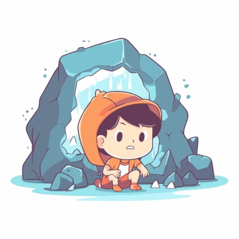 Cute little boy sitting on a rock in the ice cave.