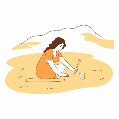 Young woman sitting on the sand and painting with water