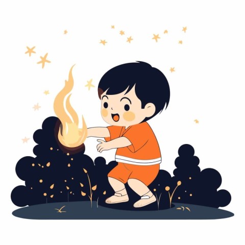 Cute little boy playing with a fire in the park