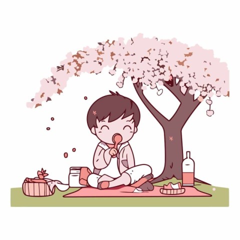 Cute little boy sitting under the cherry tree and drinking milk