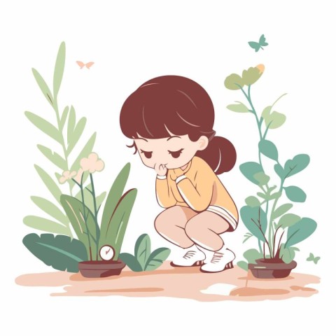 Cute little girl planting flowers in the garden.