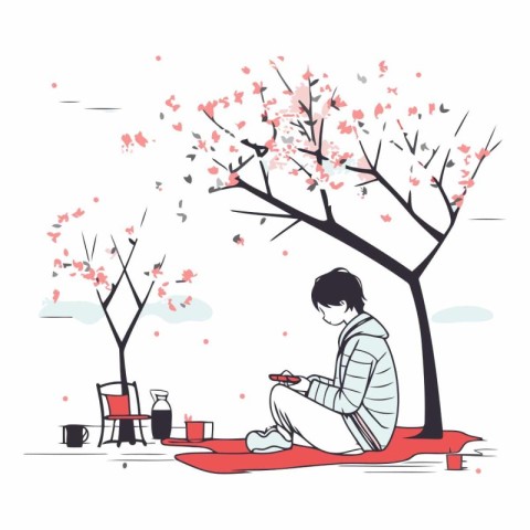 Cherry blossom tree and young man reading a book.