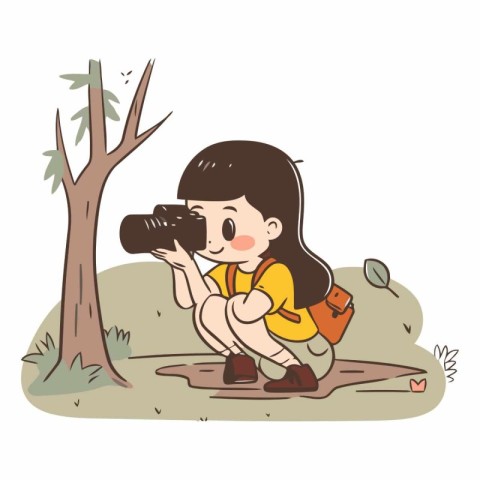 Little girl taking photo with camera in the park.