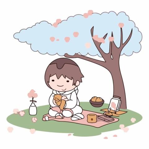 Cute little boy having breakfast in the park.