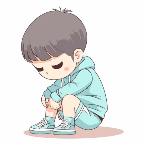 Little boy in sportswear sitting on the floor.